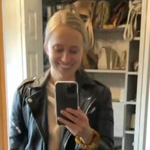 Outfit Planning testimonial for working with Personal Stylist Lena Piskorowski from client in Clinton Township, MI blonde young woman is smiling taking a selfie of her wearing a black moto jacket